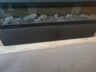 Mueble TV con adorno eléctrico de chimenea