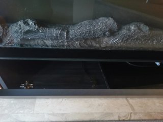 Mueble TV con adorno eléctrico de chimenea