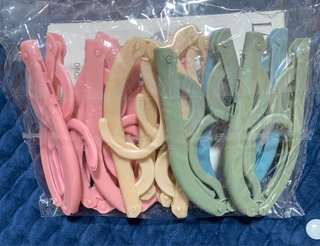 10 Perchas plegables de viaje en colores varios
