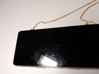 Bolso fiesta Zara negro y dorado