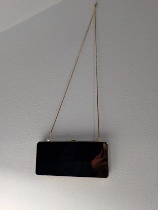 Bolso fiesta Zara negro y dorado