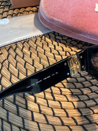 Gafas de sol Miu Miu Negras y Doradas Mujer/Femme