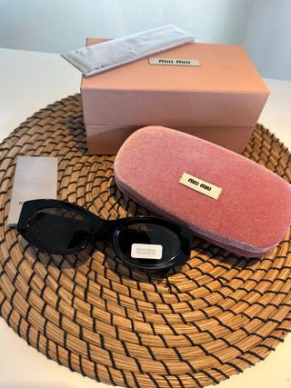 Gafas de sol Miu Miu Negras y Doradas Mujer/Femme