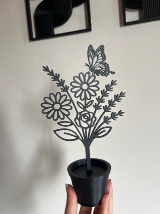 Vasetto decorativo nero con farfalla e fiori