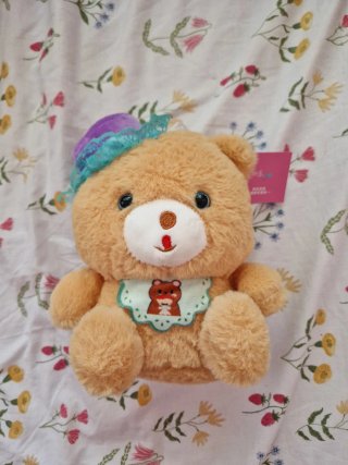 Peluche oso con sombrero y babero