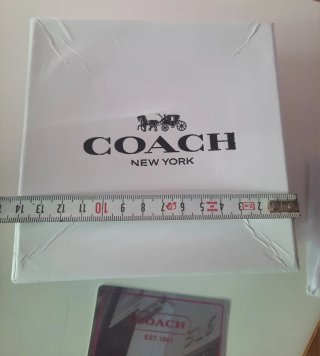Caja y bolsa Coach