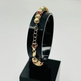 Pulsera Bolitas con circonitas rojas.