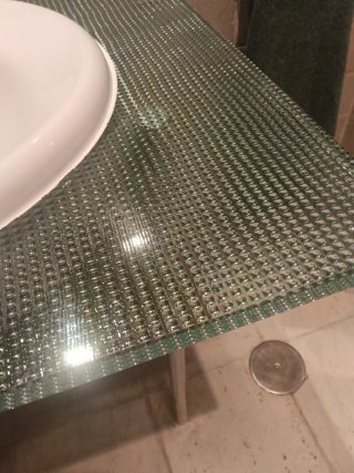 Mueble de baño cristal y madera.