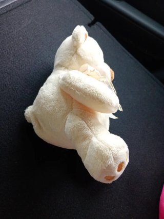 Oso de peluche crema con lazo