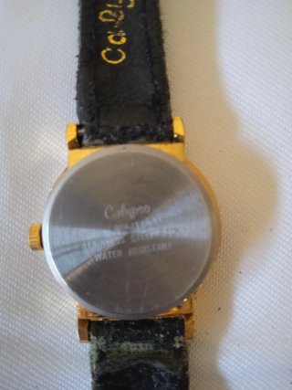 Reloj de pulsera Calypso dorado y negro