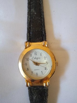 Reloj de pulsera Calypso dorado y negro