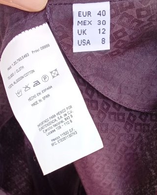 Elegante blusa de Adolfo Domínguez burdeos