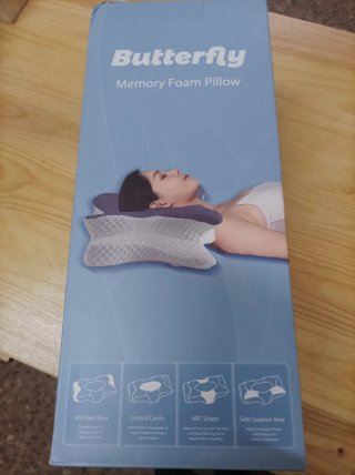 Almohada cervical y cuello azul/gris.