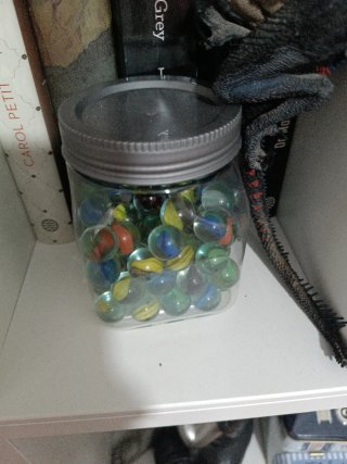 Tarro de canicas de cristal