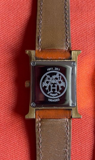 Reloj Hermès H de mujer dorado y marrón