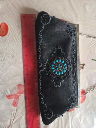 Borsa Extyn nera con dettagli turchesi