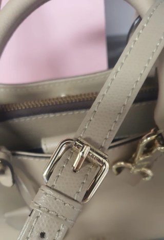 Bolso y cartera Tous beige y dorados