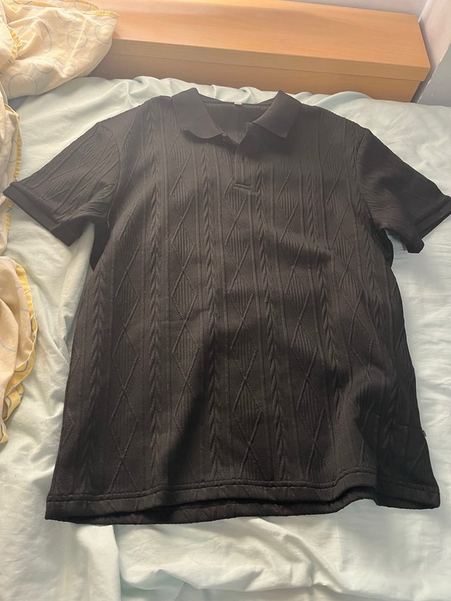 Polo negro tejido verano