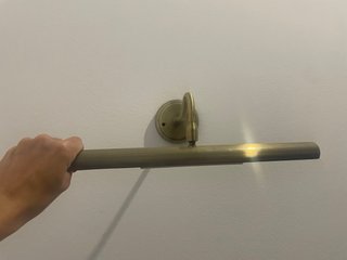 Aplique de pared dorado con movimiento