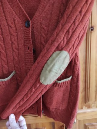 Chaqueta de punto naranja trenzada