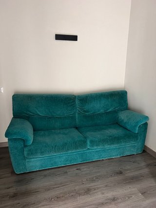 Sofá de terciopelo azul turquesa