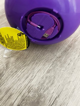 Muñeca voladora con base morada