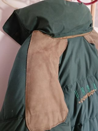 Plumífero estilo cowboy verde