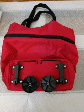 Bolsa plegable con ruedas roja