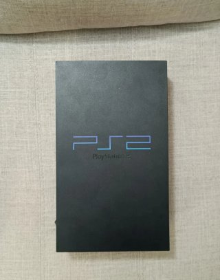 Consola PlayStation 2 con juegos y accesorios