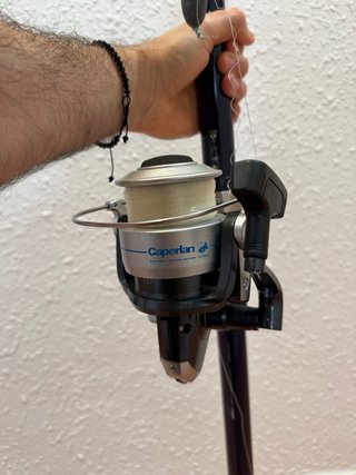 Caña de pescar con carrete y flotador