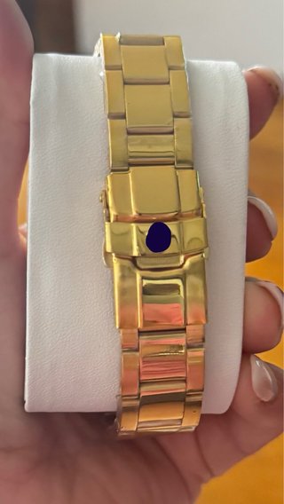 Reloj Dorado con Bisel Azul Sin usar  Costó 100e