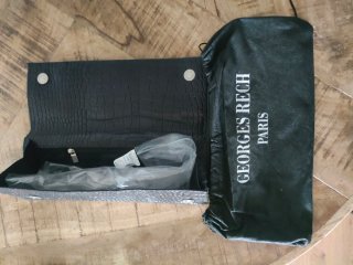 Cartera de mano cuero negro