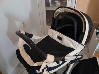 Carrito de bebé negro y beige