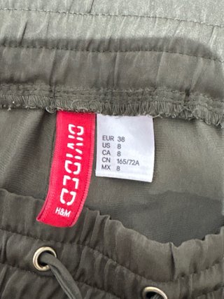 Pantalones bombachos verde oliva con cremalleras