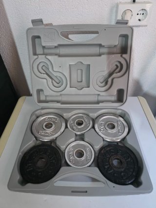 Maletín con discos de pesas