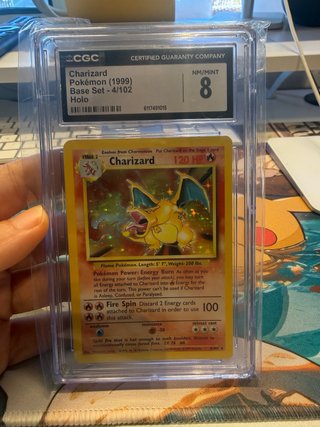 Charizard Pokémon 1999 Base Set Holo CGC 8