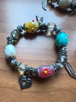 Lotto 3 braccialetti con ciondoli