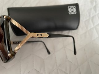 Gafas de sol Dior negras y doradas