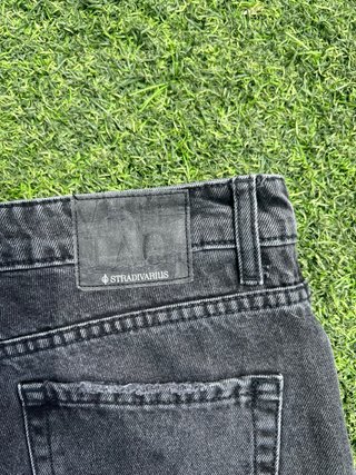 Pantalones vaqueros negros rotos