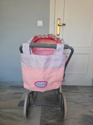 Carrito de muñeca rosa con capota