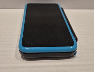 New Nintendo 2DS XL Nero / Turchese + caricatore