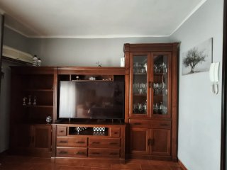 Mueble de salón madera y cristal