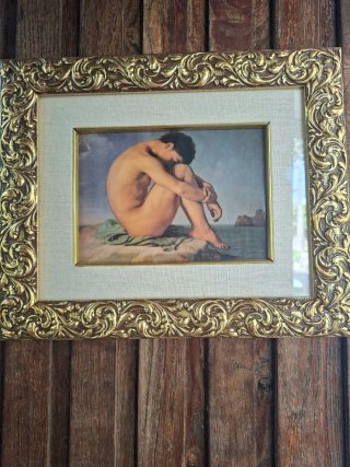 Quadro uomo nudo seduto in riva al mare cornice do