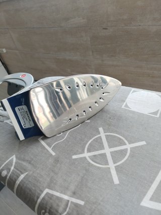 Plancha Taurus y tabla de planchar