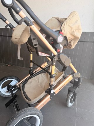 Carrito de bebé rosa gold