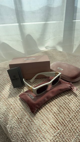 Occhiali da sole Miu Miu SMU09WB5322 bianchi e dorati