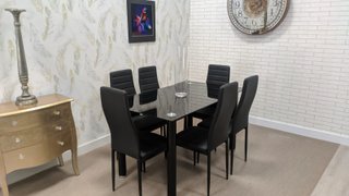 Mesa de comedor cristal + 6 sillas negras