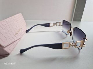 Gafas de sol Ana Hickman doradas y moradas