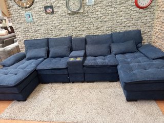Sofá modular azul en forma de U