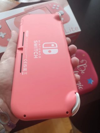 Nintendo Switch Lite Coral + Funda Unicornio